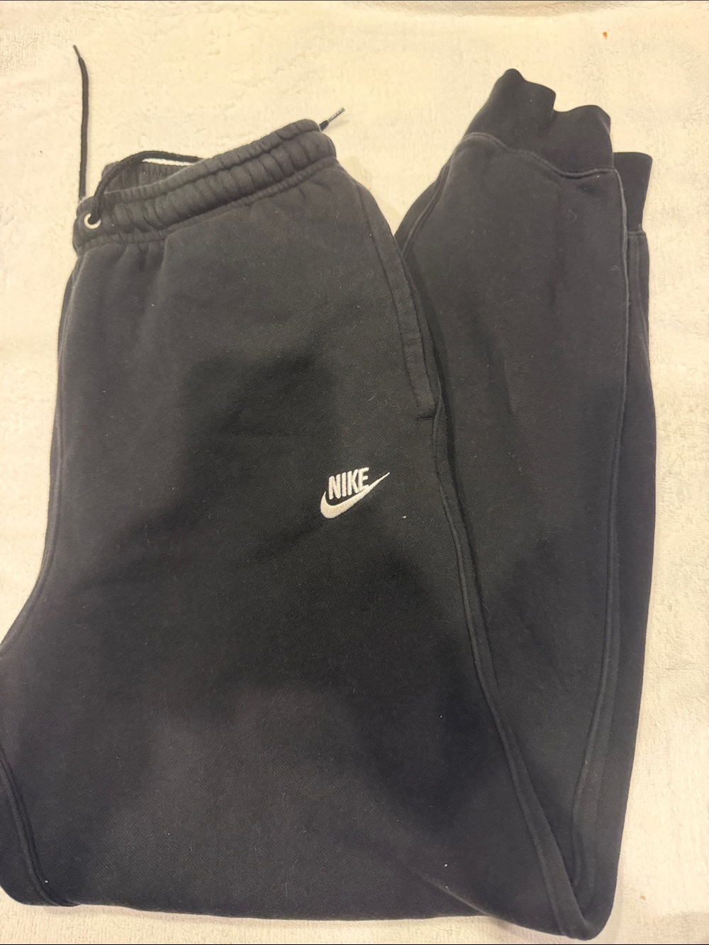 Nike Black men’s Fleece Joggers with White Swoosh